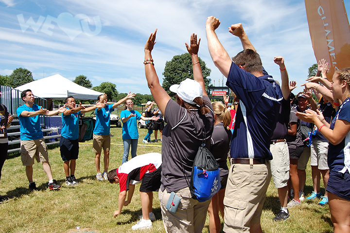 WeLoveU volunteers cheer on participants of the Special Olympics