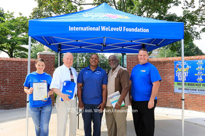 WeLoveU volunteers clean the streets in Hempstead, Long Island, NY.