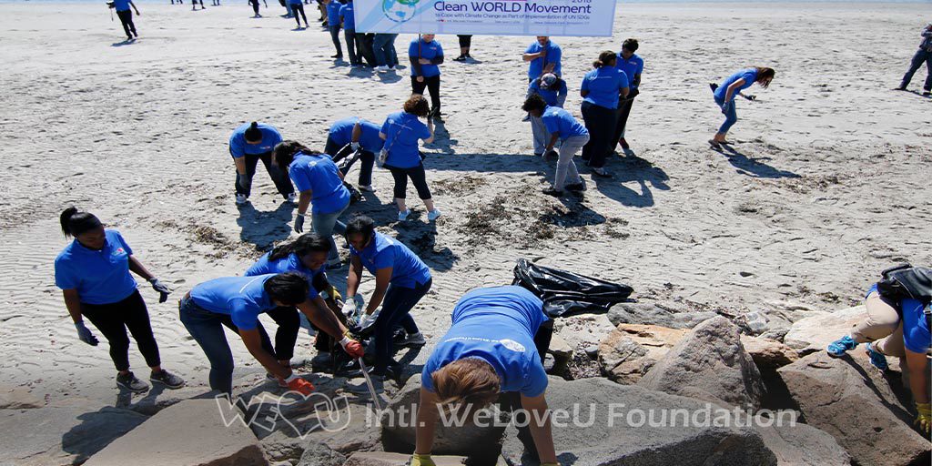 WeLoveU volunteers clean Seaside Park in Bridgeport, CT.
