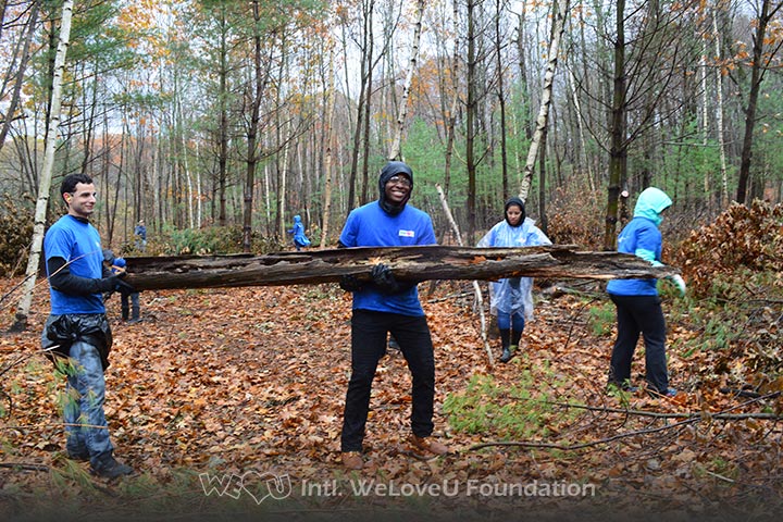 WeLoveU volunteers clean Barrett Park in Massachusetts.