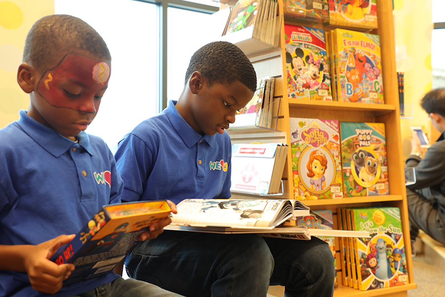 WeLoveU volunteers reading books in Barnes & Noble
