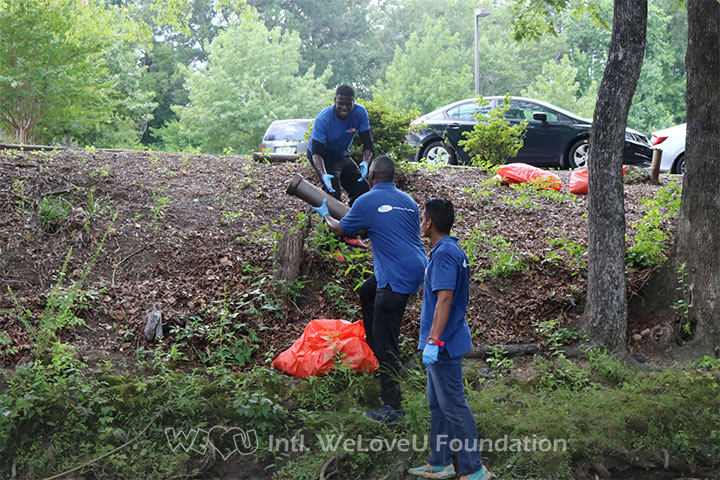 WeLoveU volunteers clean Fayetteville's Cross Creek.