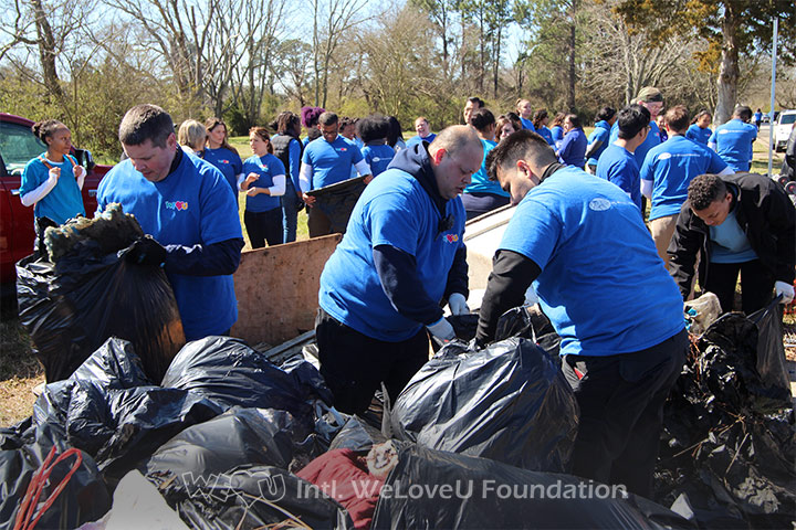 WeLoveU volunteers clean Central Park in Newport News, VA.