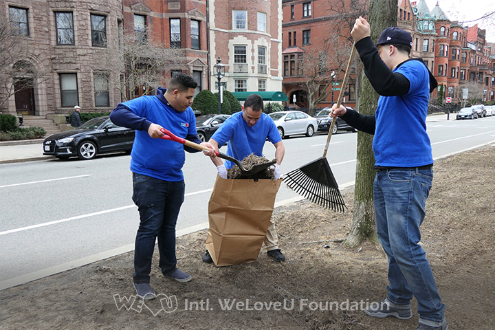 WeLoveU volunteers clean Commonwealth Avenue Mall in Boston, MA.