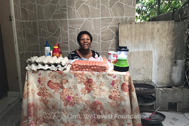 A woman conducts her side business with the lantern