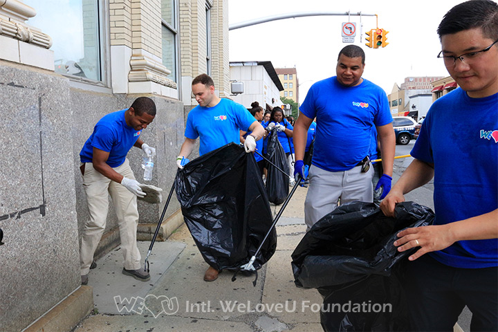 WeLoveU volunteers clean the streets in Hempstead, Long Island, NY.