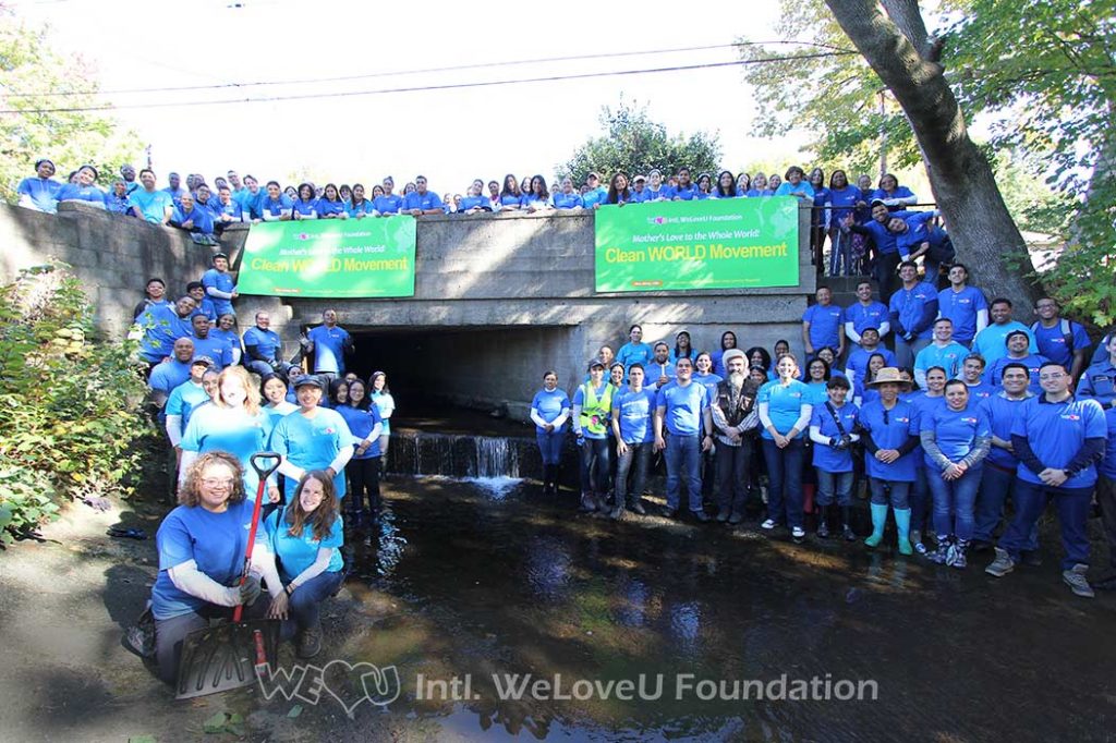 WeLoveU volunteers clean Wolf Creek in Ridgefield, NJ.