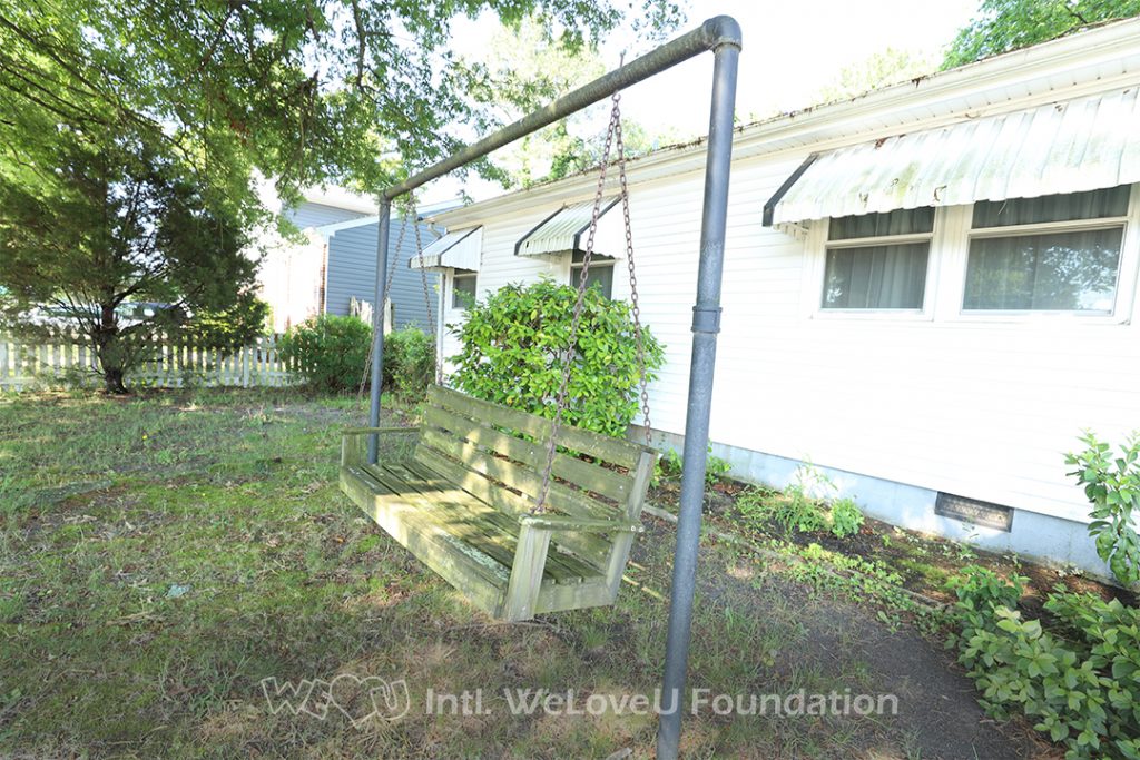 Ms. Monroe's porch swing before WeLoveU volunteers arrived