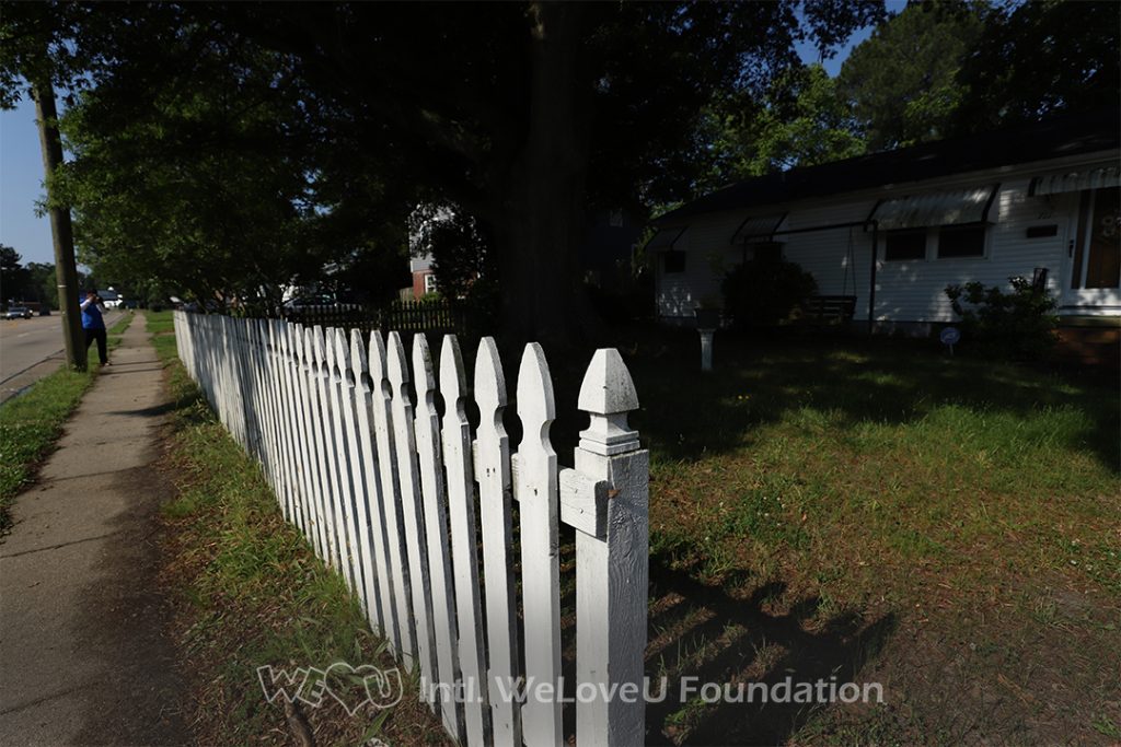 Ms. Monroe's fence before WeLoveU volunteers arrived