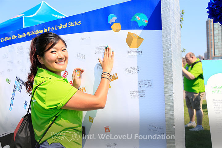 A WeLoveU walkathon participant at the SDG activity booth.