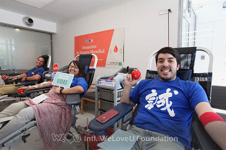 Three blood donors at WeLoveU's Worldwide Blood Drive Movement