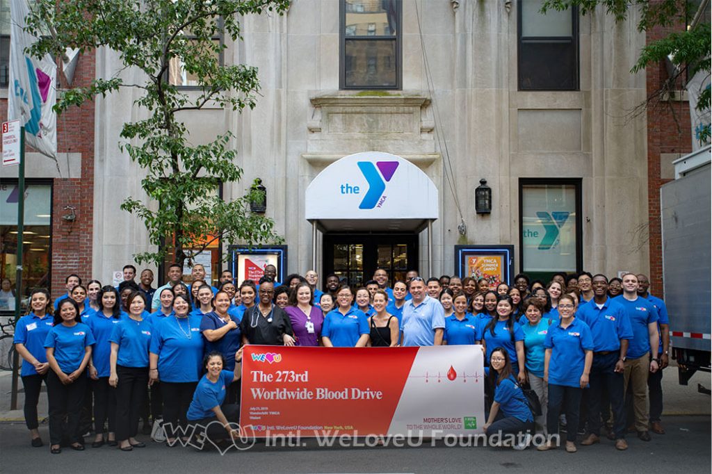 Group photo outside the YMCA in New York City for WeLoveU's 2019 Worldwide One-Two Blood Drive Movement