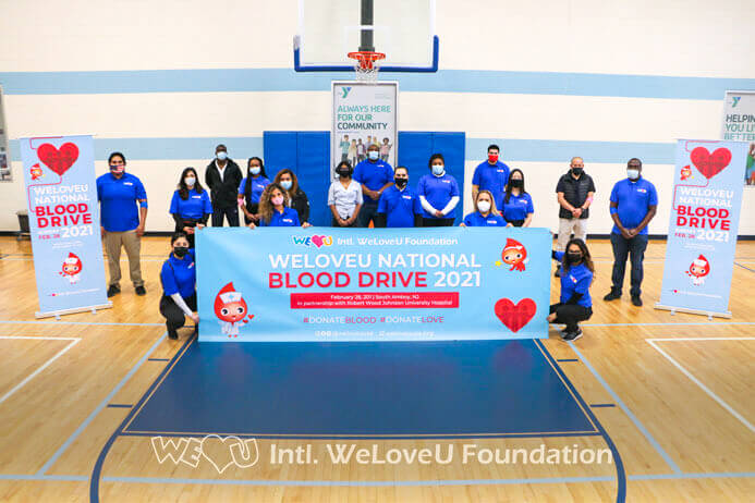 Blood donors take a group photo in South Amboy's YMCA gymnasium