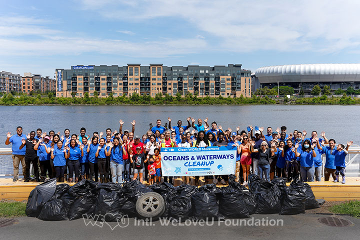 Group shot of HDR and WeLoveU Foundation volunteers with collected trash