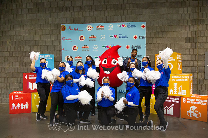 Mr. Hotspot, WeLoveU cheer team, and the American Red Cross blood drop mascot take a group photo