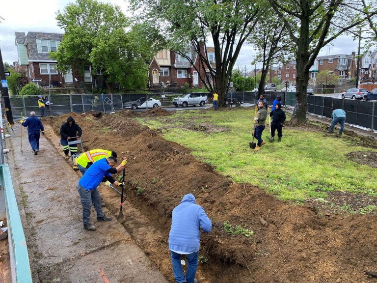 Volunteers digging up the ground