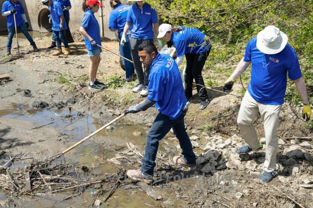 WeLoveU volunteers removing big sticks from Gary-Keyhole Reservoir