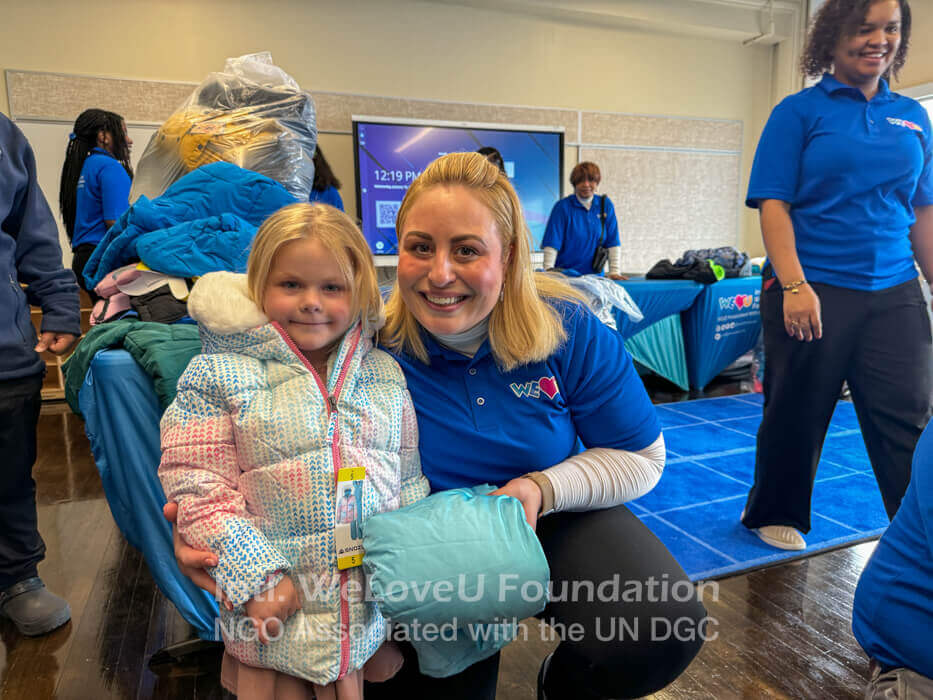 a volunteer and student with a new coat